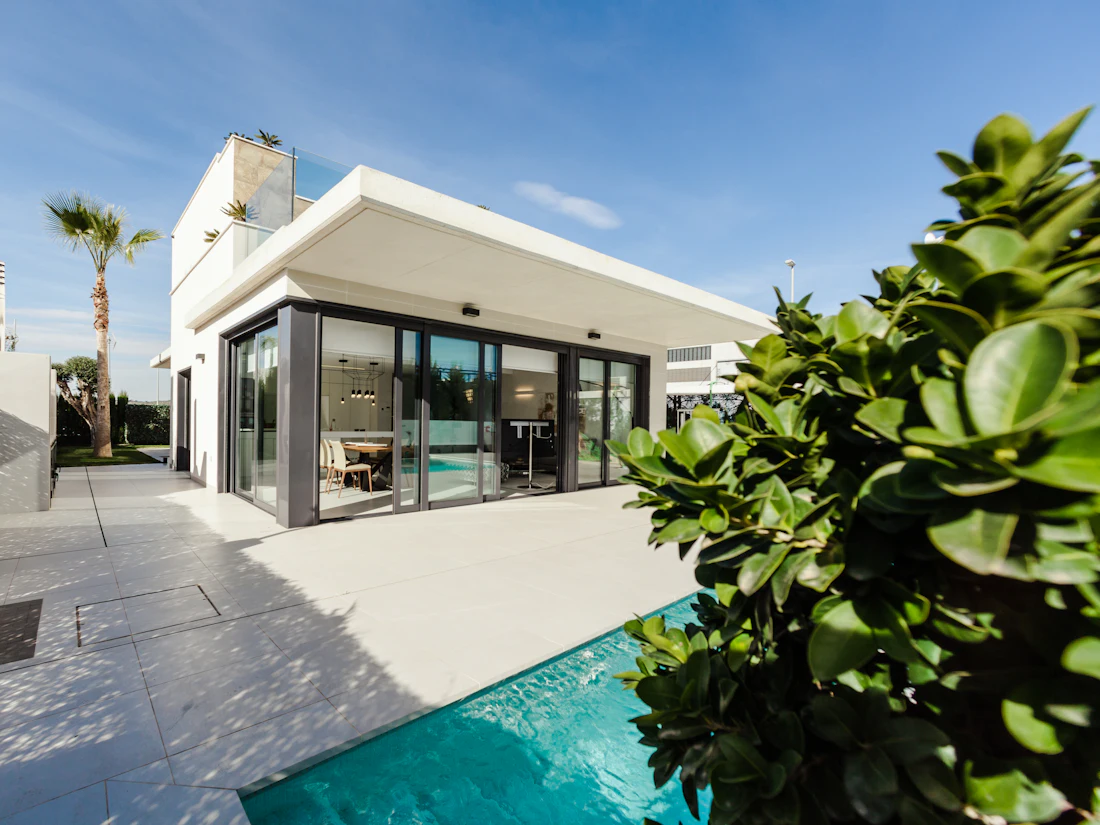 A modern white house with a pool